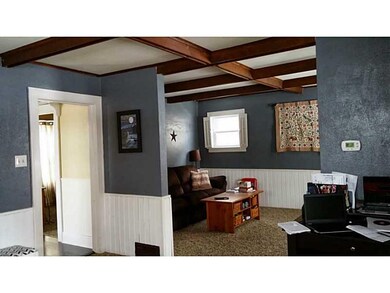 Living Room. Open with wood beam ceilings.