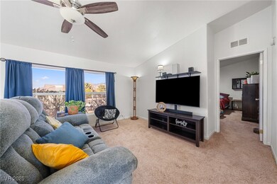 Living area with baseboards, visible vents, a ceil