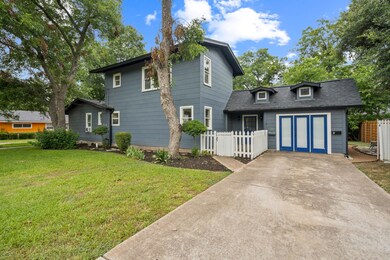 View of front facade featuring driveway