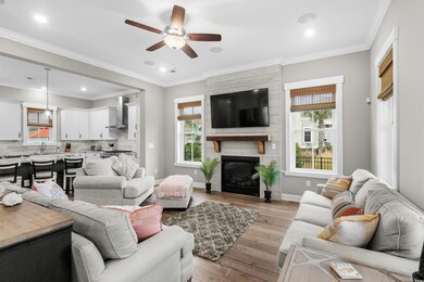 Living room featuring a fireplace, light hardwood 