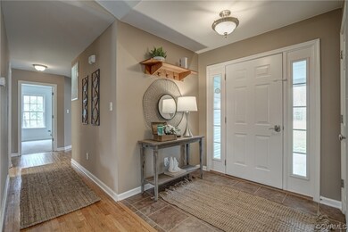 Spacious foyer with coat closet.