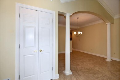 Entry - Large coat closet, arched detailing with c