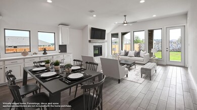 Dining area with ceiling fan, a fireplace, wood f
