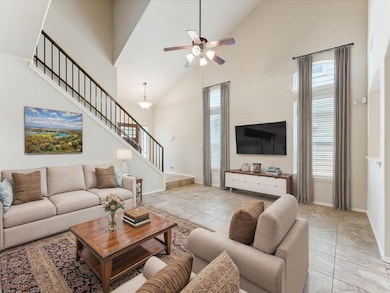 Living area featuring high vaulted ceiling, healt