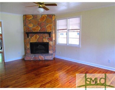 Living Room. STONE WOOD-BURNING FIREPLACE