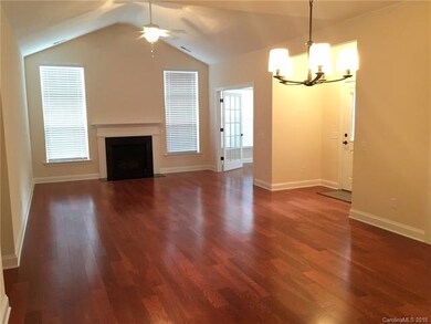 View of open Dining and Greatroom with Fireplace.