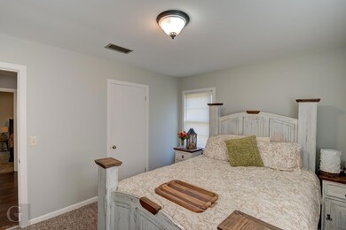 Bedroom with dark carpet
