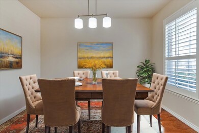 Dining space with wood-type flooring and plenty of