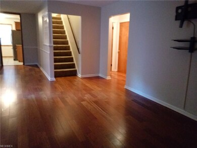 Spacious living room with wood flooring