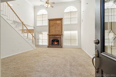 Vaulted living room features wood burning fireplac