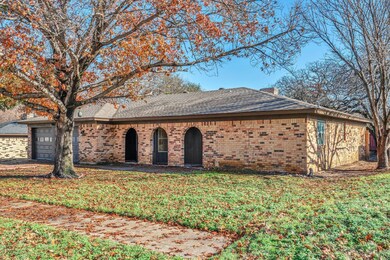 Ranch-style home featuring a garage