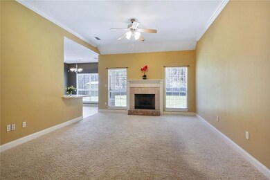 Spacious Den with wood burning fireplace, open to