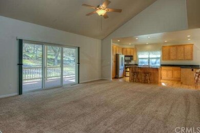 Spacious great room with soaring ceilings and larg