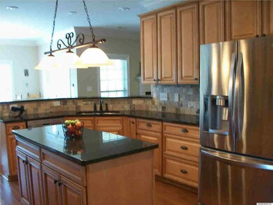 Another view of the gourmet kitchen with huge island.