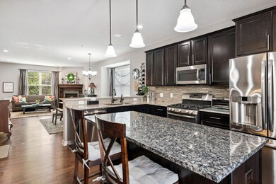 The kitchen boast dark cabinets, and gorgeous granite!  This main floor is wide open and lives like a single family home.