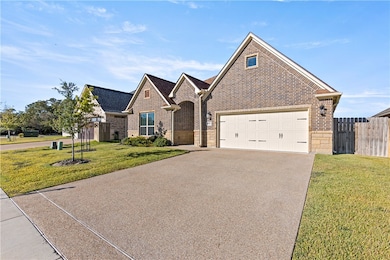 View of front of property with brick siding and concrete​​‌​​​​‌​​‌‌​​​‌​​‌‌‌​​​​​‌‌‌​​‌​​‌‌​​​‌ driveway