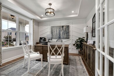 Study with glass French doors off of the foyer entry.