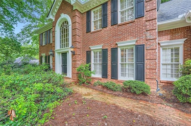 Entrance to property featuring brick siding