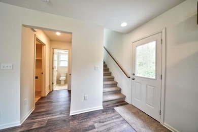 View to stairs half bath and utility mud