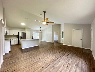 Open Living Room to Kitchen to Dining Room