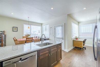 Kitchen with a sink, dishwasher, light wood-style