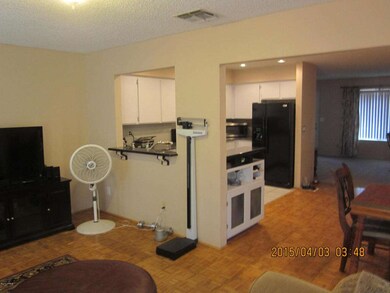 VIEW OF KITCHEN & FAMILY ROOM FROM L..R.