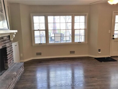 Light and bright Great Room with large hearth at f