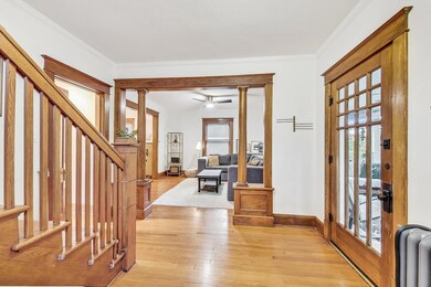 Gracious foyer with extensive millwork and high ce