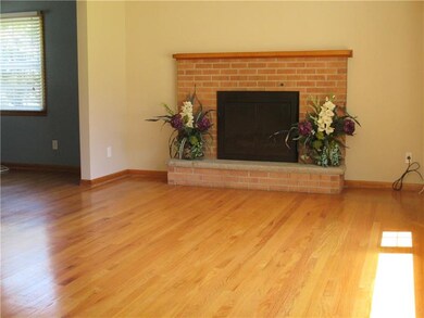 LIVING ROOM WITH HARDWOOD FLOORS AND GAS FIREPLACE