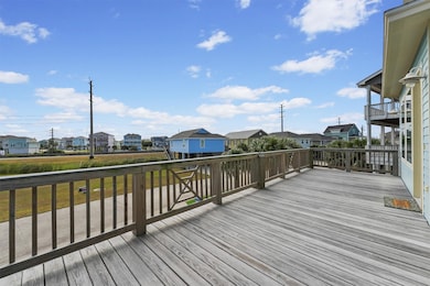 Enjoy panoramic water and neighborhood views from the elevated front balcony—an ideal space for lounging, grilling, or stargazing under the island sky.