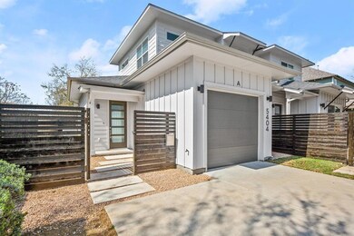 View of front facade with concrete driveway, an a