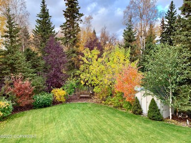 Landscaped lawn backs to greenbelt