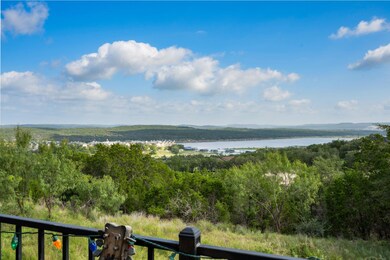 Water view with a heavily wooded area