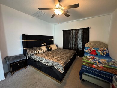 Bedroom featuring carpet and ceiling fan