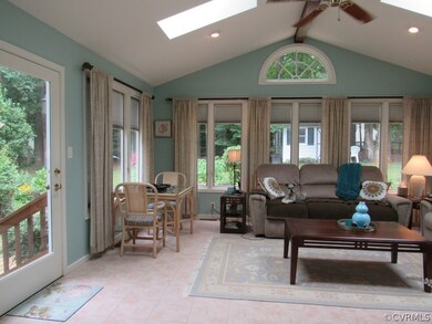 Great room/ family room overlooks rear yard. It is