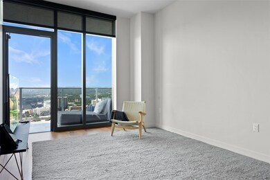 Sitting room with baseboards and floor to ceiling