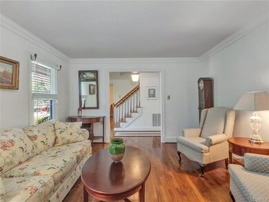 Formal living room - wood floors, crown molding an