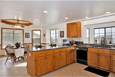 Granite, updated kitchen with ceramic floors and a walk in pantry.