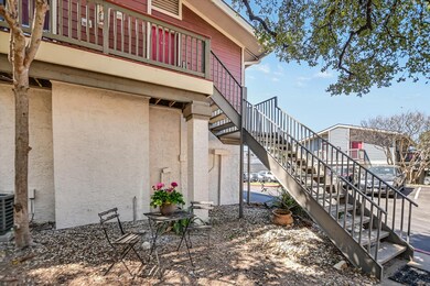 View of home's exterior with stairs and stucco si