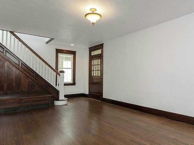 Entry/Foyer. Grand staircase leads to the upper le