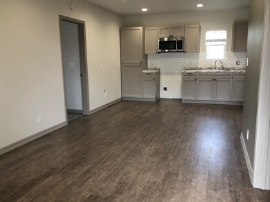 Living room flows into kitchen - New Stove has been installed