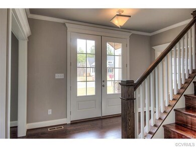 9 foot ceilings and 3/4 glass doors create an inviting foyer