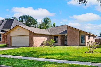 This is a single-story brick home featuring a neat