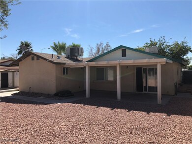 Back of property with a patio area, central AC uni