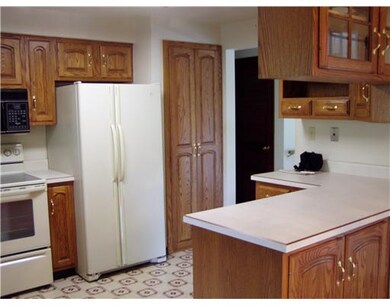 Kitchen. Lots of storage in these oak cabinets and