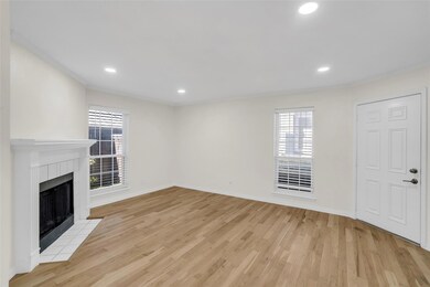 Unfurnished living room featuring light hardwood /