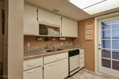 Kitchen with door to enclosed patio