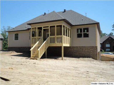 Rear View of Home.  Covered Deck and Large Backyar