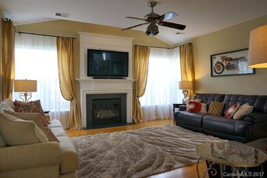 Family room with fireplace, gas logs and ceiling f