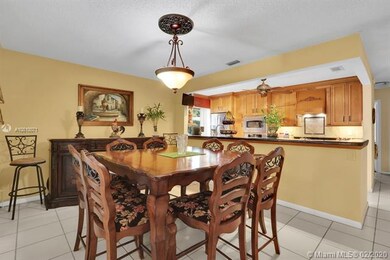 KITCHEN OPENS UP TO APPEALING DINING AREA